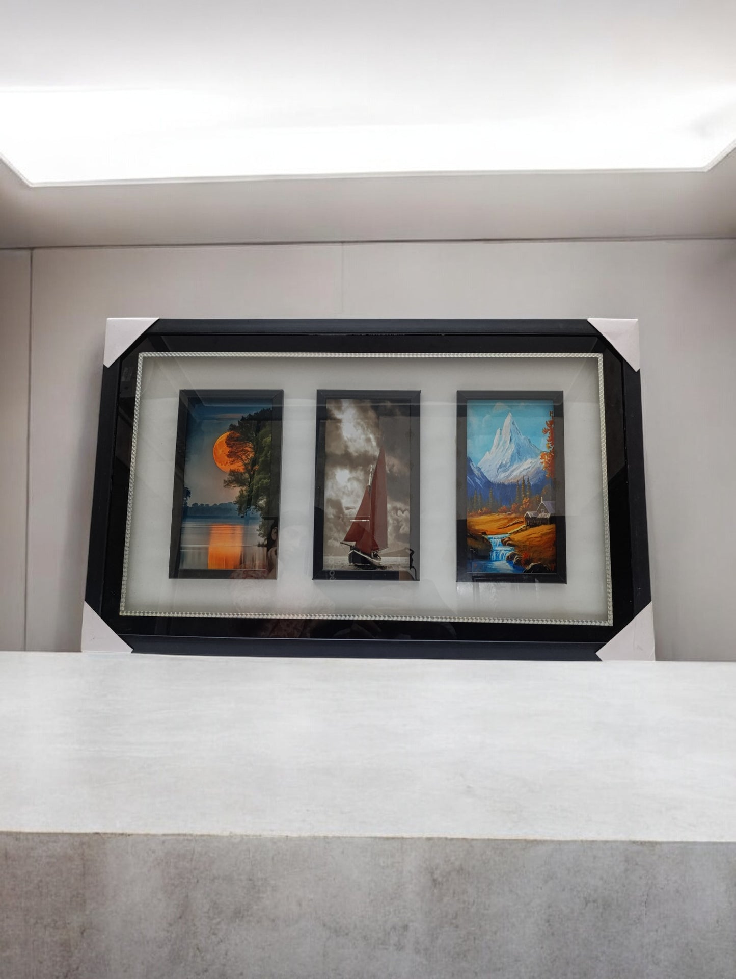 Frame with three paintings