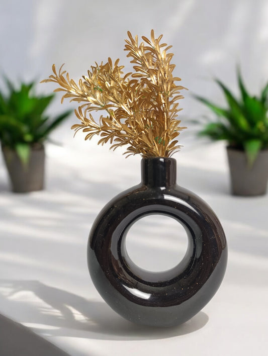 Black donut ceramic vase with golden flower