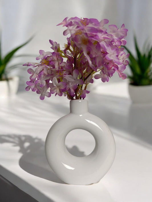 White donut ceramic vase with pink flower